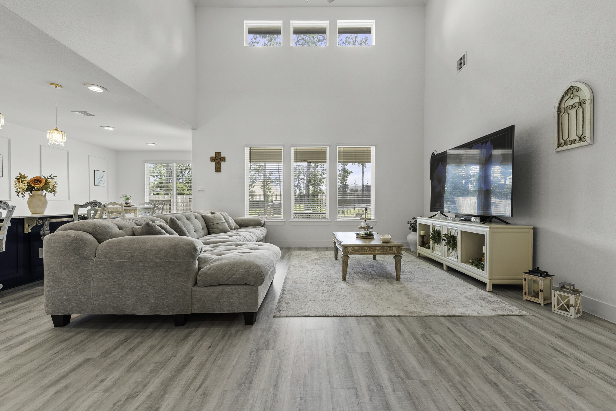14130 Savage River Conroe, TX 77384 - Photo 9 of 33 a living room with furniture and a flat screen tv