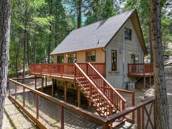a view of house with a roof deck