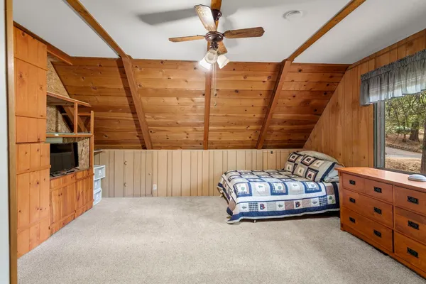 a bedroom with furniture and window