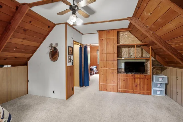 a view of an empty room with a fireplace