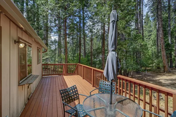 a view of balcony with furniture and wooden deck