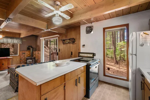 a kitchen that has a cabinets a sink and a stove