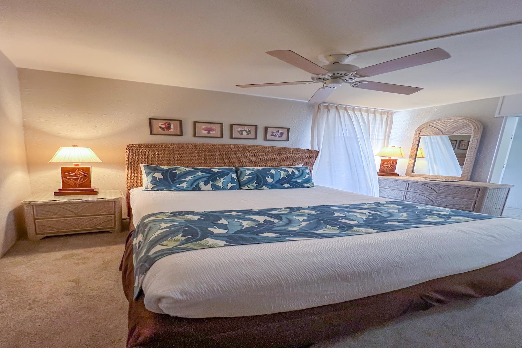 3601 Lower Honoapiilani Road, Unit 414 Lahaina, HI 96761 - Photo 15 of 28 a bedroom with a bed and a dresser
