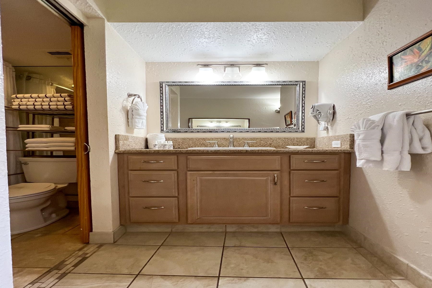 3601 Lower Honoapiilani Road, Unit 414 Lahaina, HI 96761 - Photo 16 of 28 a kitchen with a stove and a sink