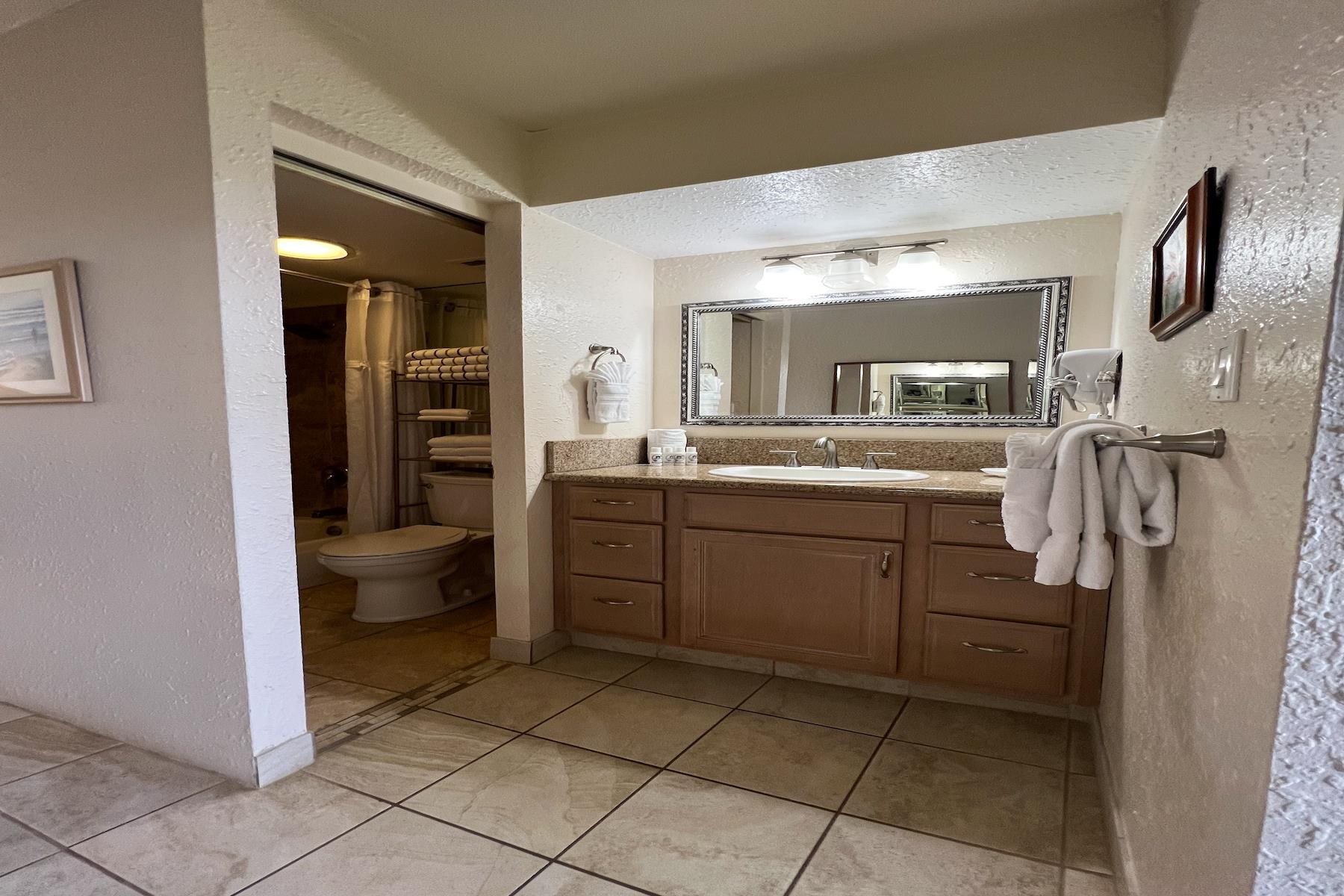 3601 Lower Honoapiilani Road, Unit 414 Lahaina, HI 96761 - Photo 18 of 28 a kitchen with a sink and refrigerator