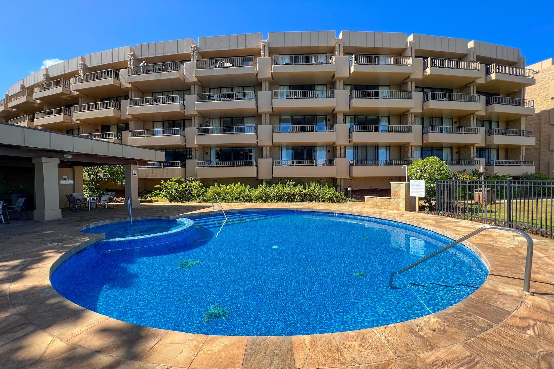 3601 Lower Honoapiilani Road, Unit 414 Lahaina, HI 96761 - Photo 20 of 28 a view of a swimming pool with outdoor seating