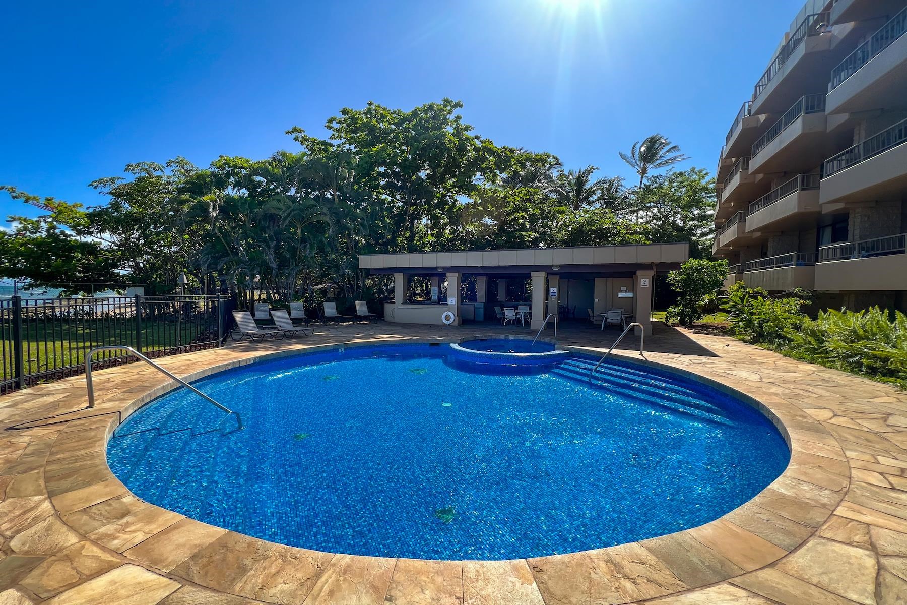 3601 Lower Honoapiilani Road, Unit 414 Lahaina, HI 96761 - Photo 21 of 28 a view of a house with swimming pool and porch