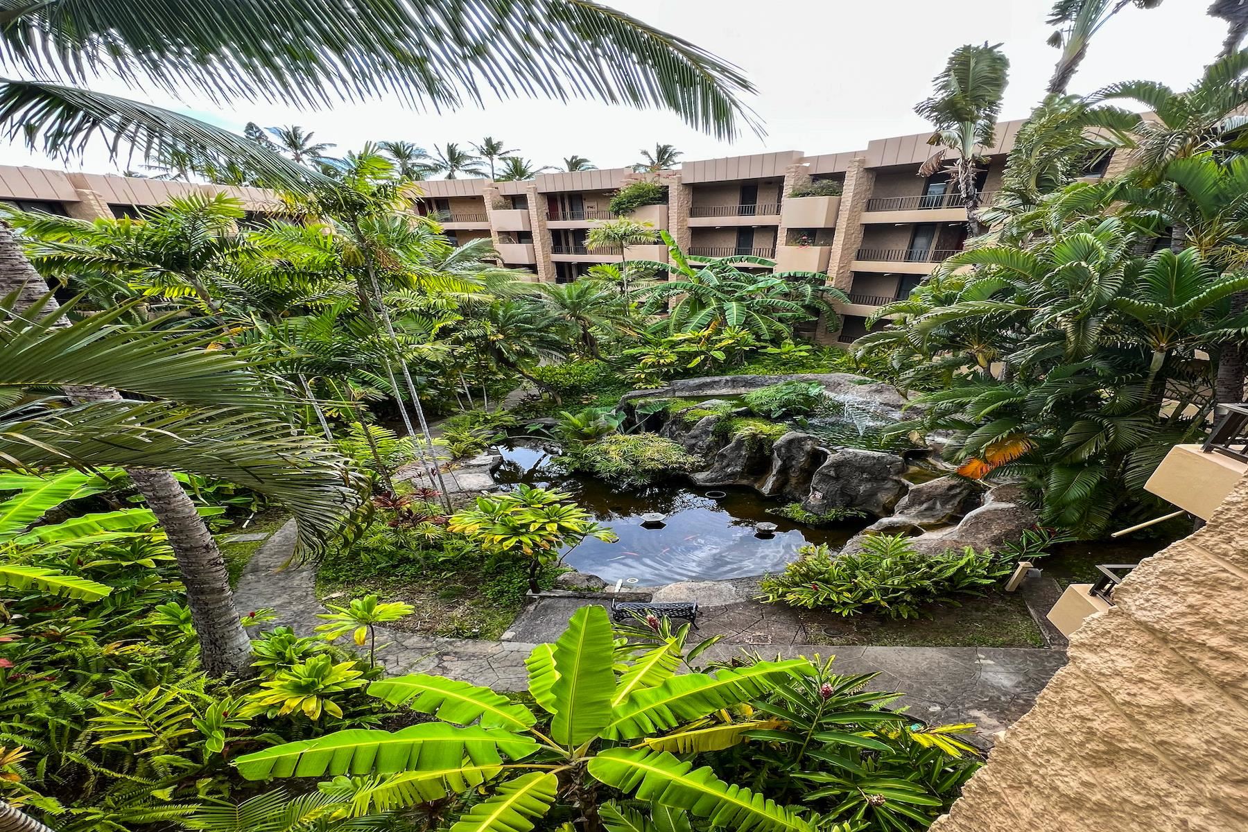 3601 Lower Honoapiilani Road, Unit 414 Lahaina, HI 96761 - Photo 3 of 28 a view of a garden with a house
