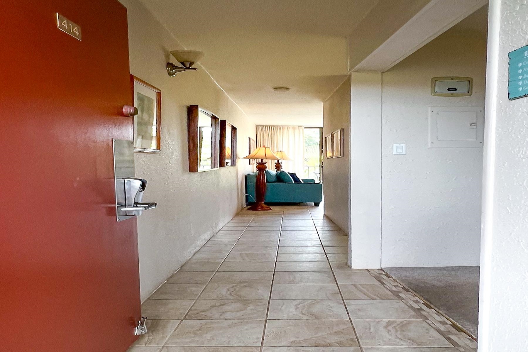 3601 Lower Honoapiilani Road, Unit 414 Lahaina, HI 96761 - Photo 4 of 28 a view of a hallway with a furniture