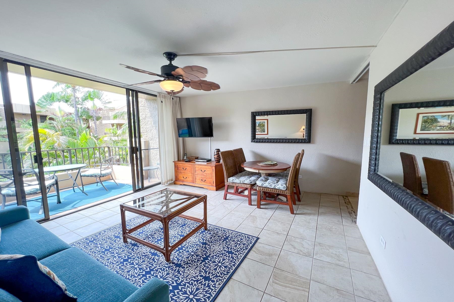 3601 Lower Honoapiilani Road, Unit 414 Lahaina, HI 96761 - Photo 6 of 28 a living room with furniture and a fireplace