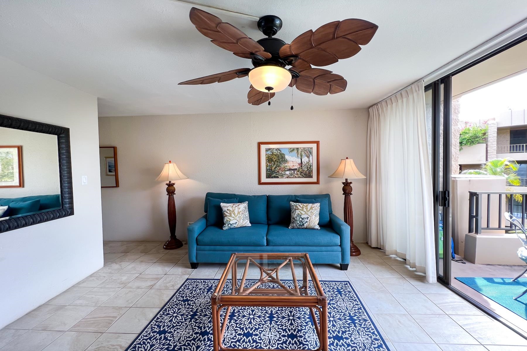3601 Lower Honoapiilani Road, Unit 414 Lahaina, HI 96761 - Photo 7 of 28 a living room with furniture and wooden floor