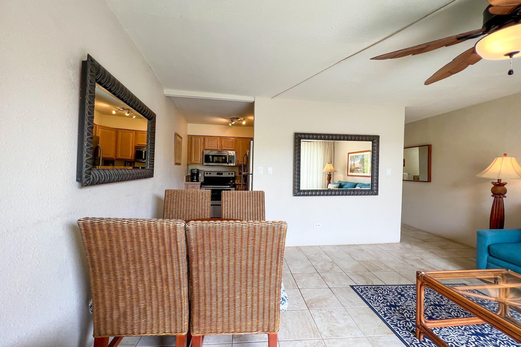 3601 Lower Honoapiilani Road, Unit 414 Lahaina, HI 96761 - Photo 9 of 28 a living room with furniture and a flat screen tv