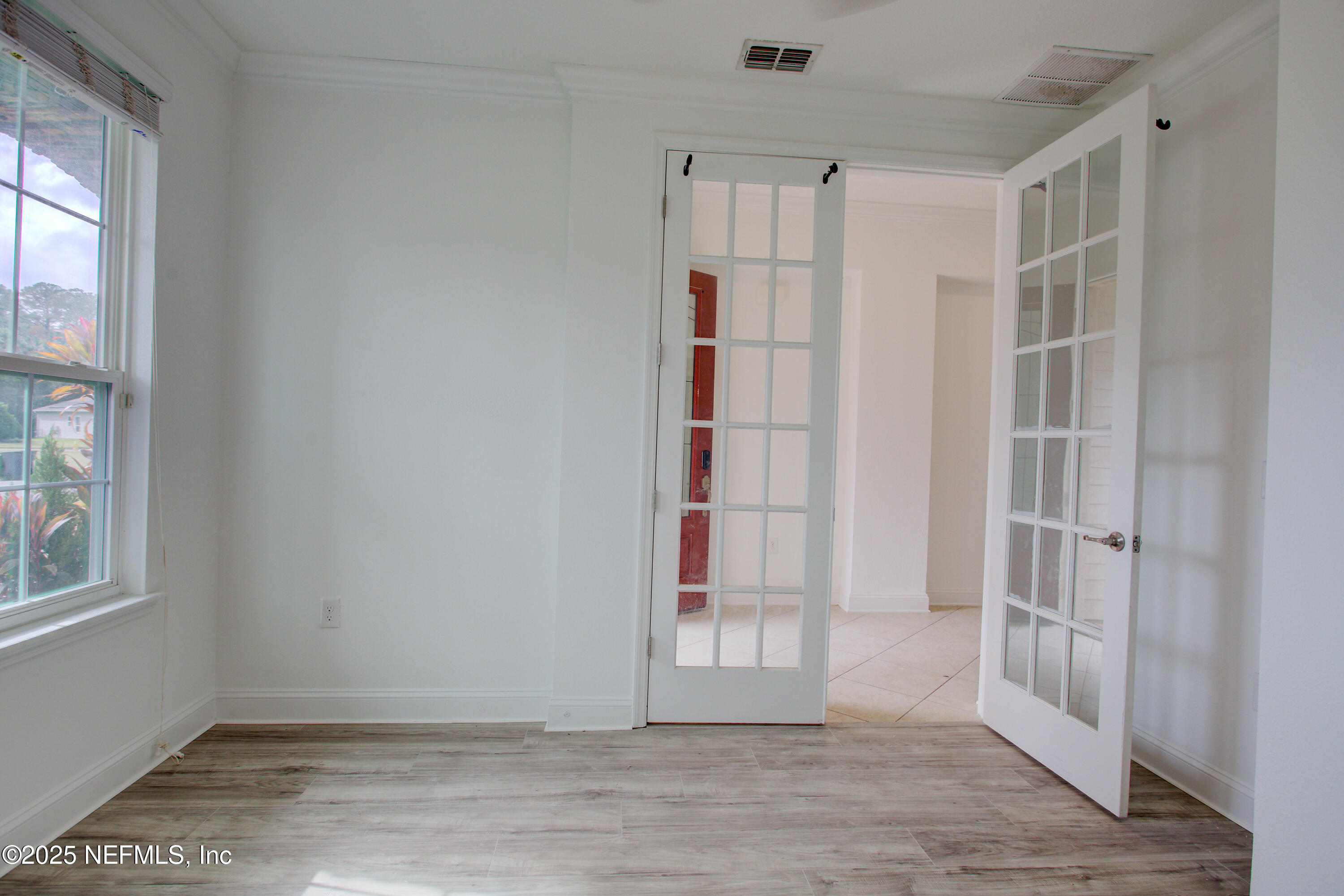 174 Antilles Road St. Augustine, FL 32092 - Photo 19 of 88 a view of empty room with wooden floor and entryway