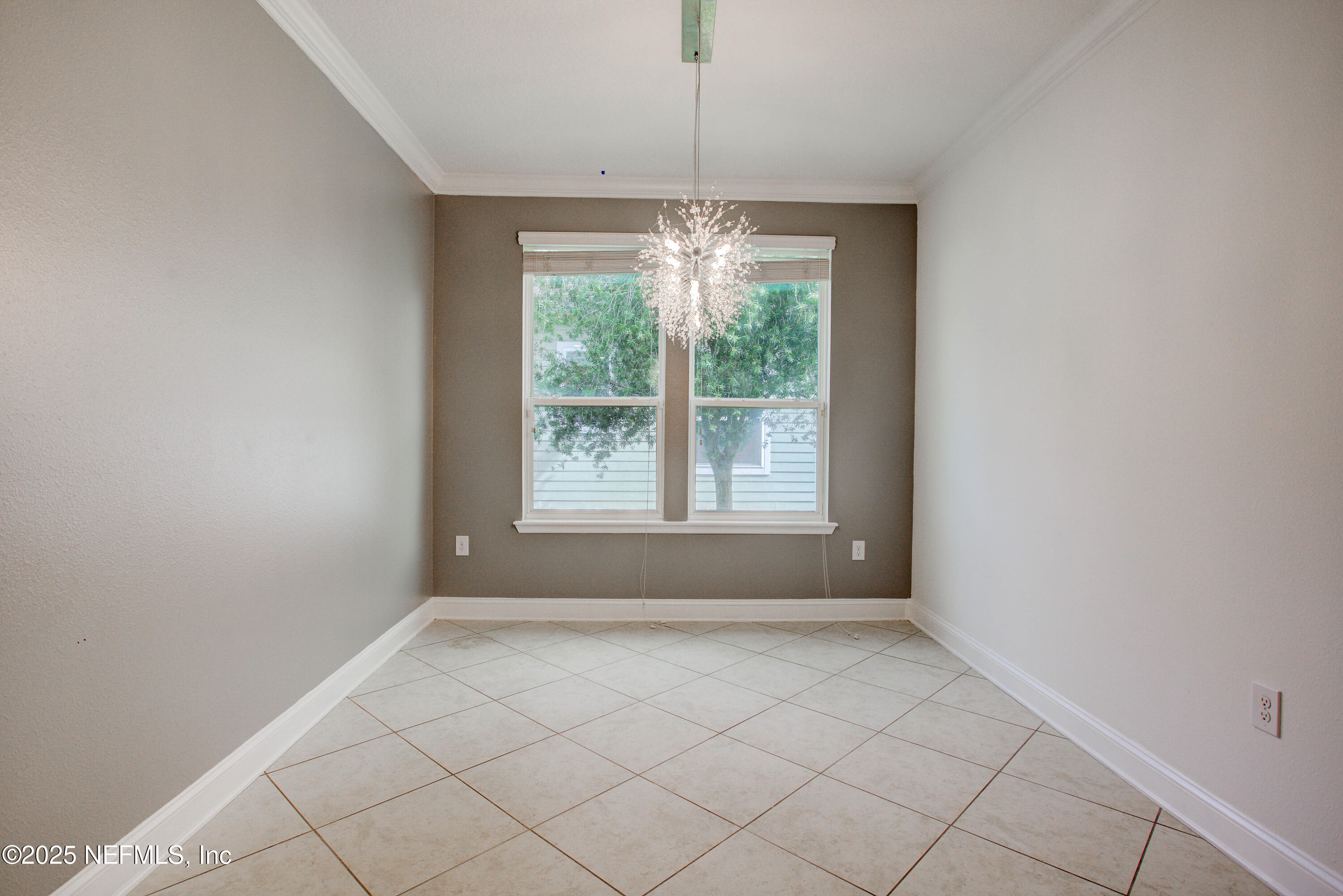 174 Antilles Road St. Augustine, FL 32092 - Photo 25 of 88 an empty room with windows and outdoor view