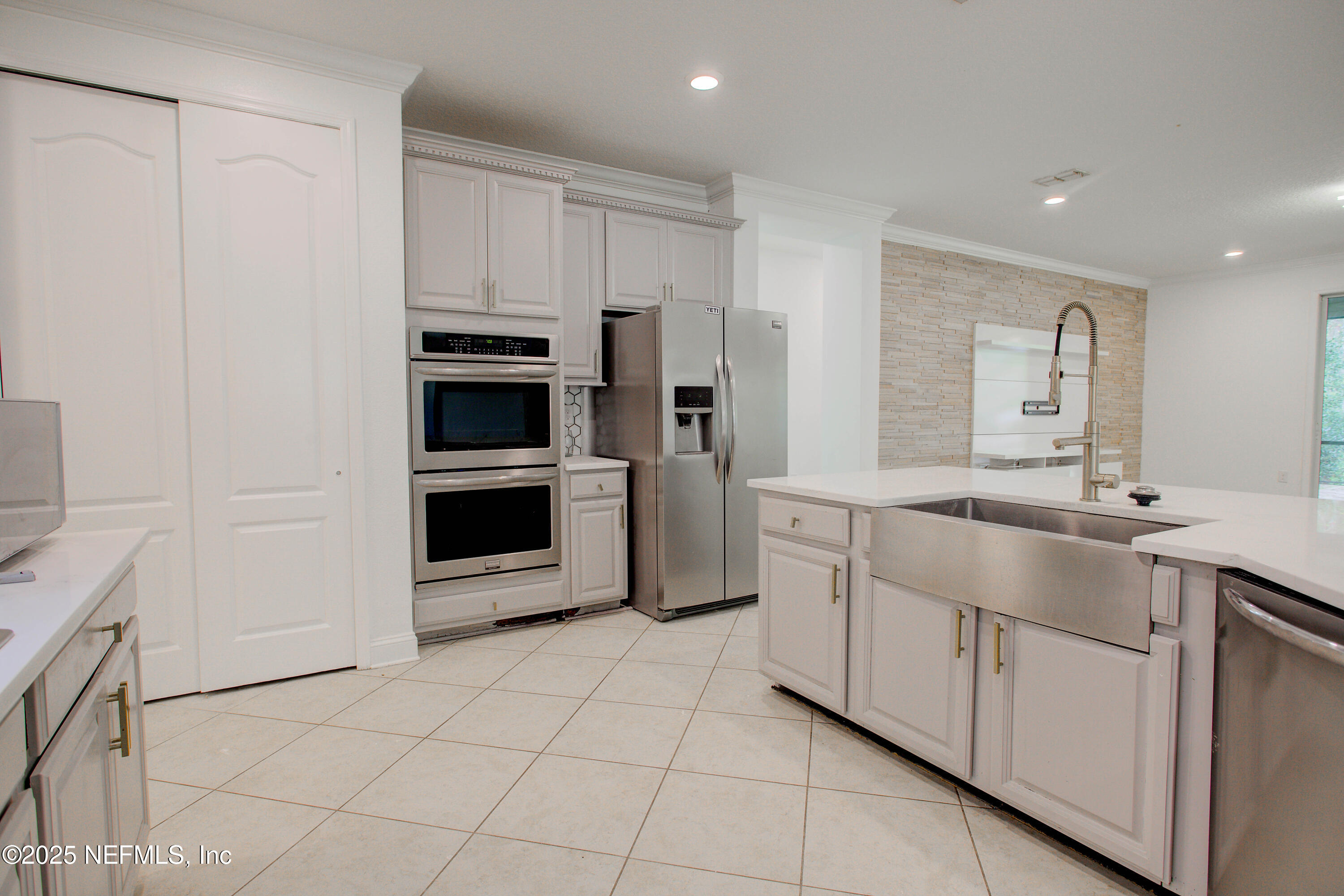 174 Antilles Road St. Augustine, FL 32092 - Photo 30 of 88 a kitchen with granite countertop a refrigerator and a sink