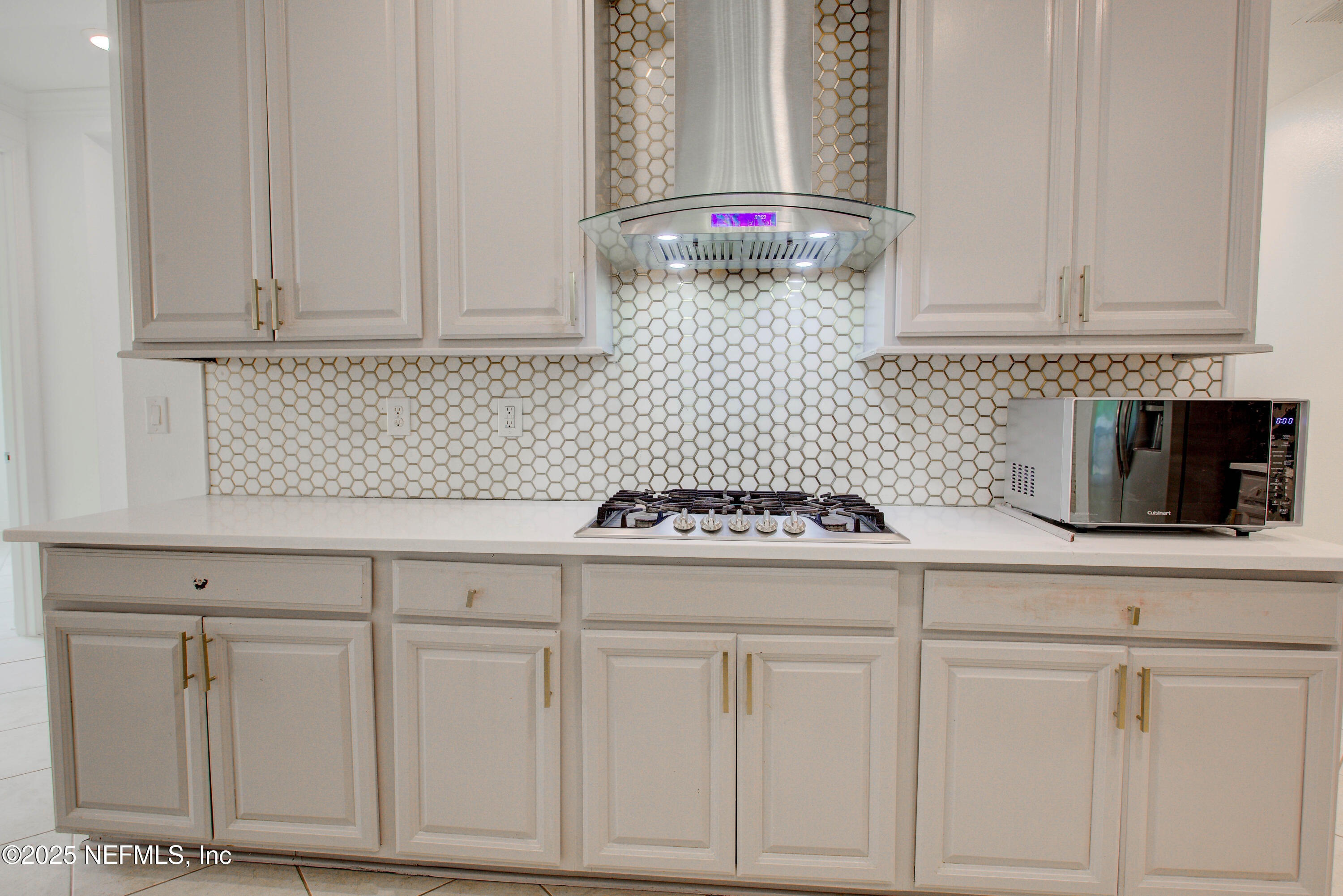 174 Antilles Road St. Augustine, FL 32092 - Photo 34 of 88 a kitchen with white cabinets and sink