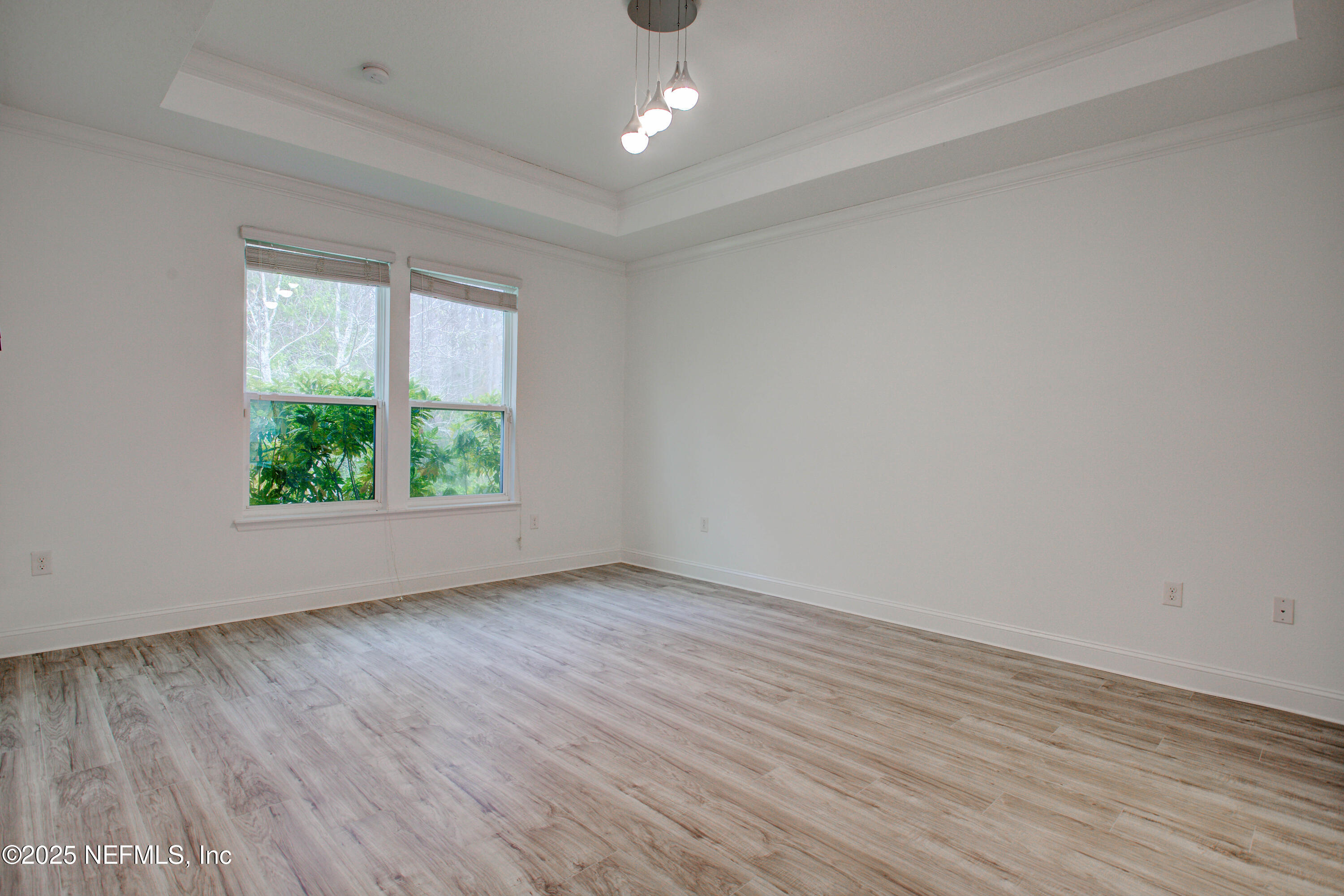 174 Antilles Road St. Augustine, FL 32092 - Photo 47 of 88 wooden floor in an empty room with a window