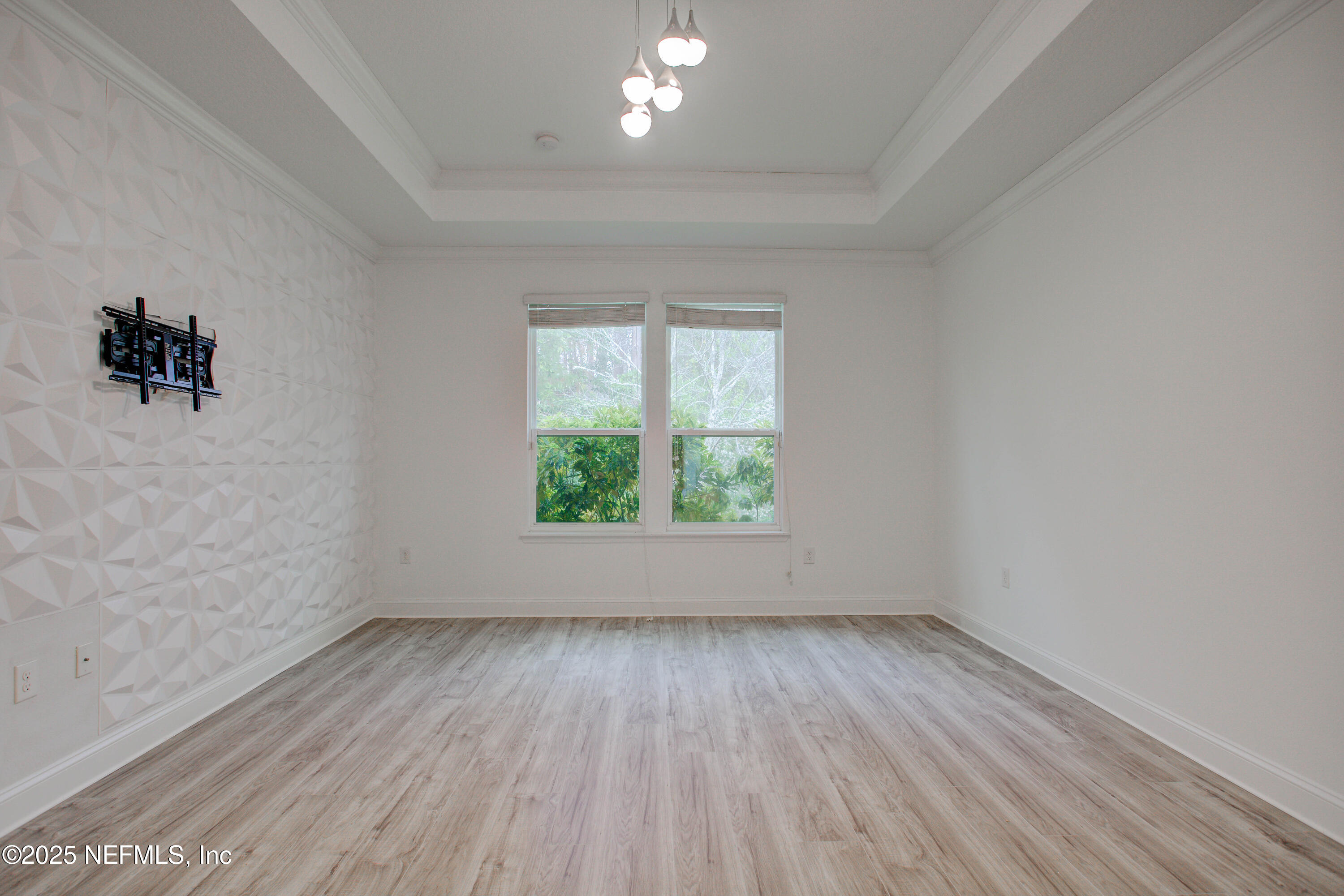 174 Antilles Road St. Augustine, FL 32092 - Photo 48 of 88 an empty room with wooden floor and windows