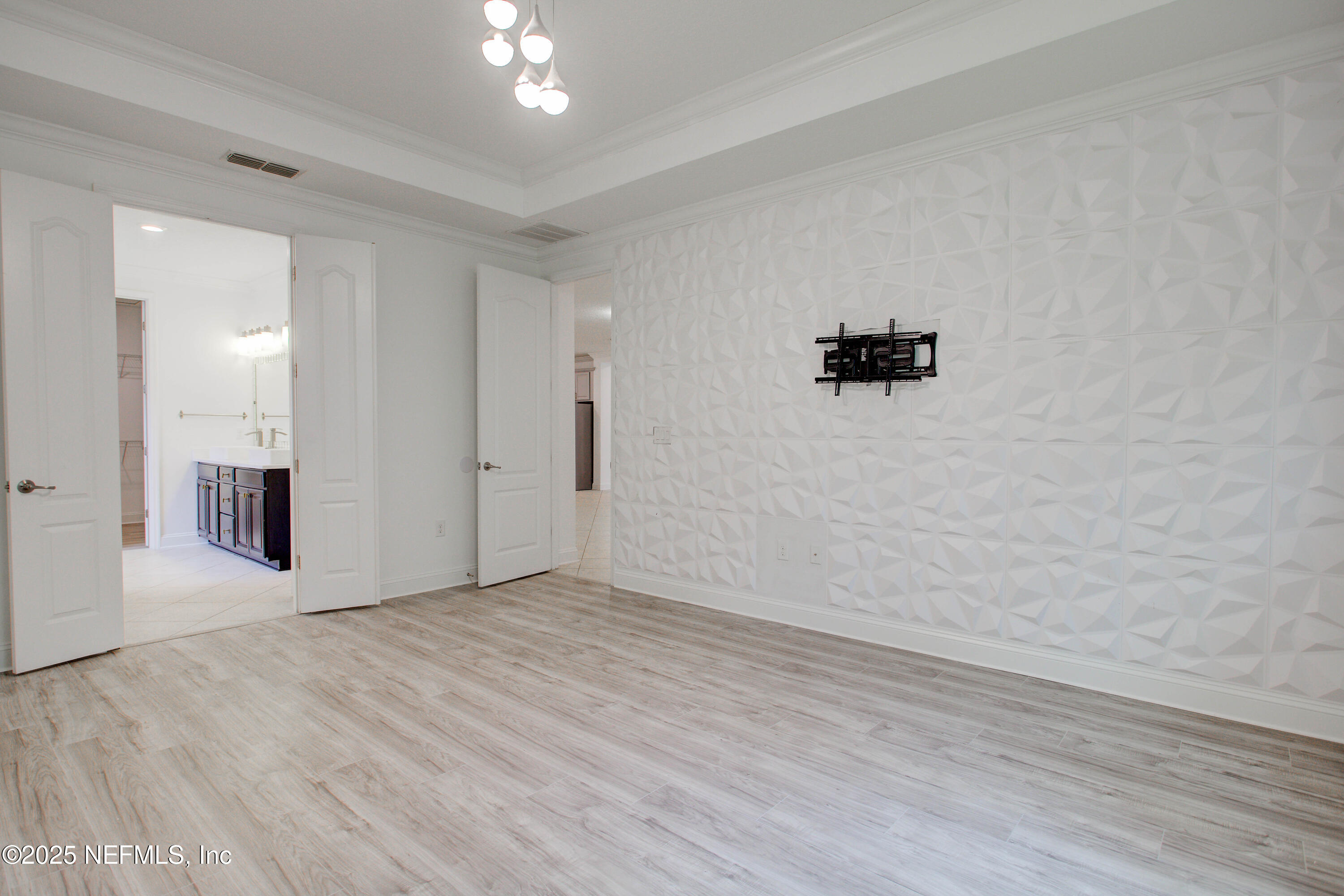 174 Antilles Road St. Augustine, FL 32092 - Photo 51 of 88 wooden floor in an empty room with a window