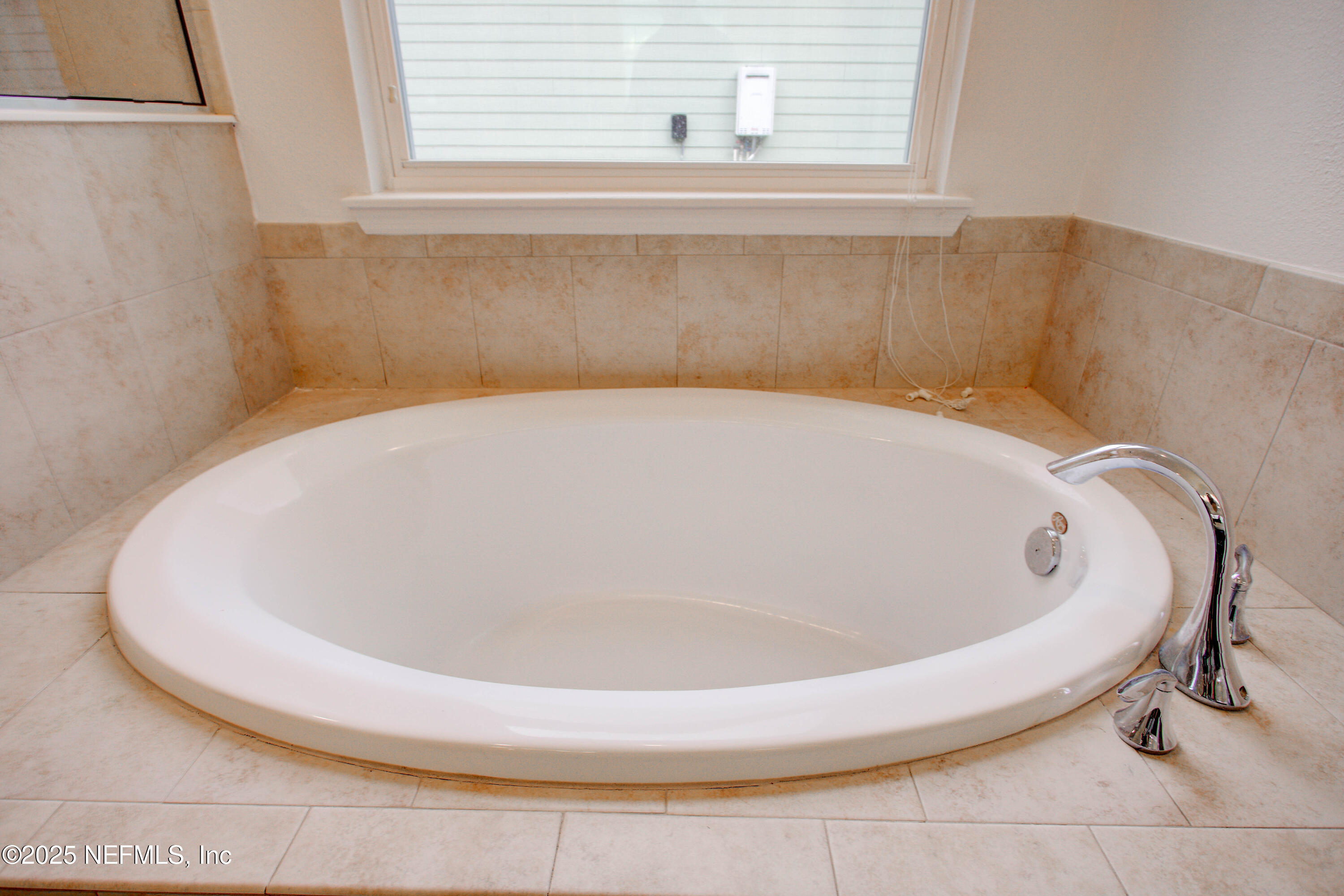 174 Antilles Road St. Augustine, FL 32092 - Photo 59 of 88 a white bath tub sitting in a bathroom