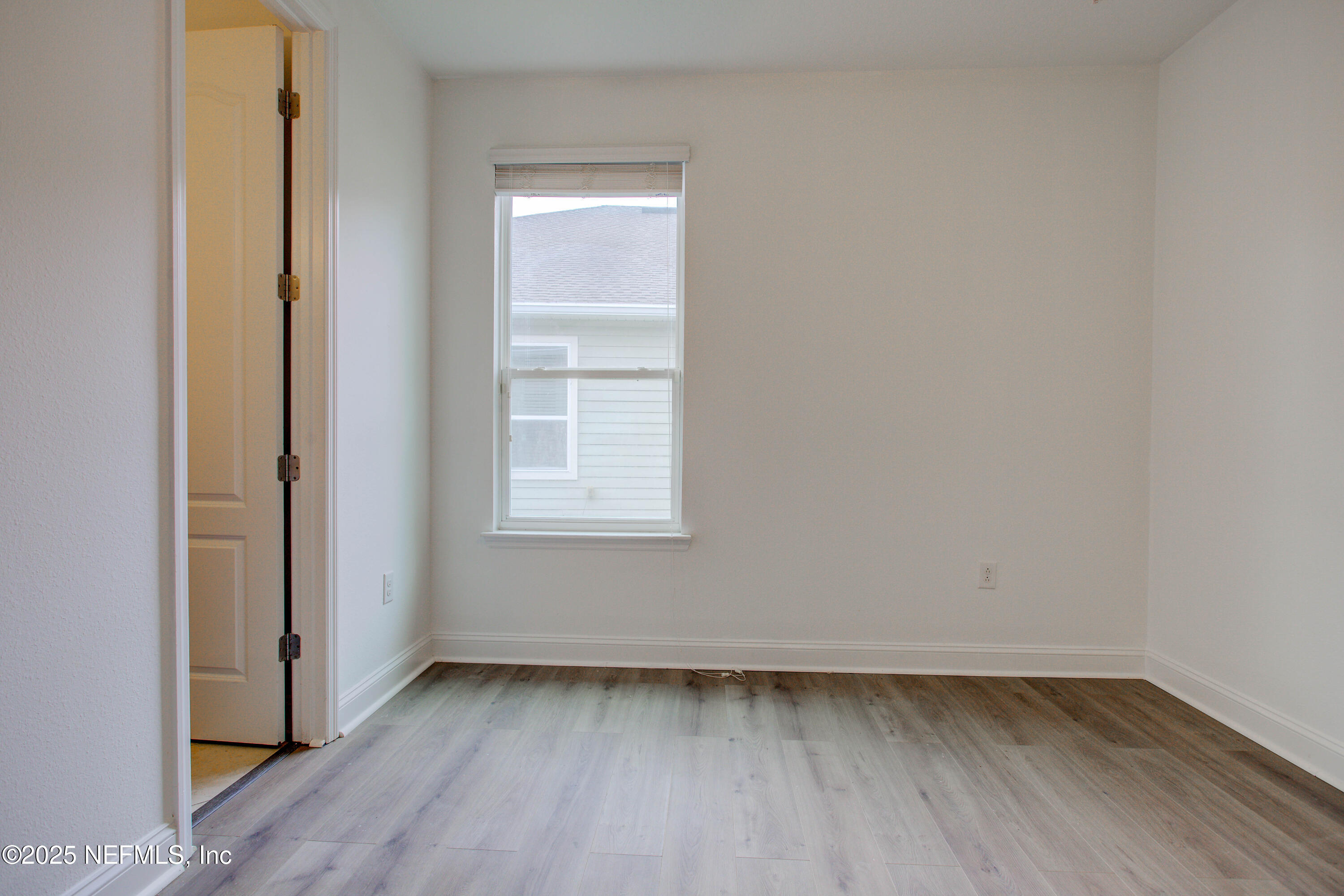 174 Antilles Road St. Augustine, FL 32092 - Photo 63 of 88 a view of a room that has wooden floor and window