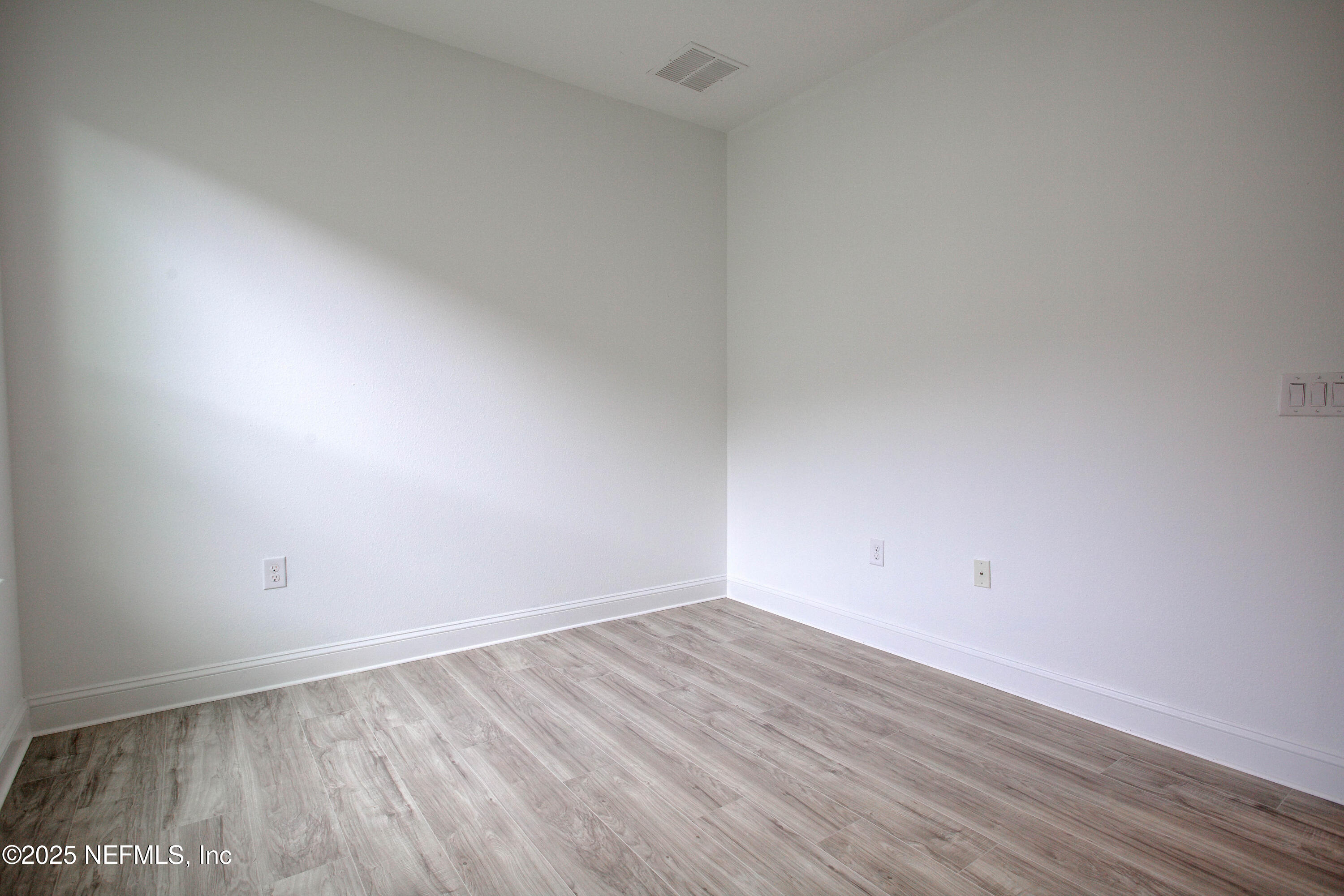 174 Antilles Road St. Augustine, FL 32092 - Photo 68 of 88 a view of an empty room with wooden floor