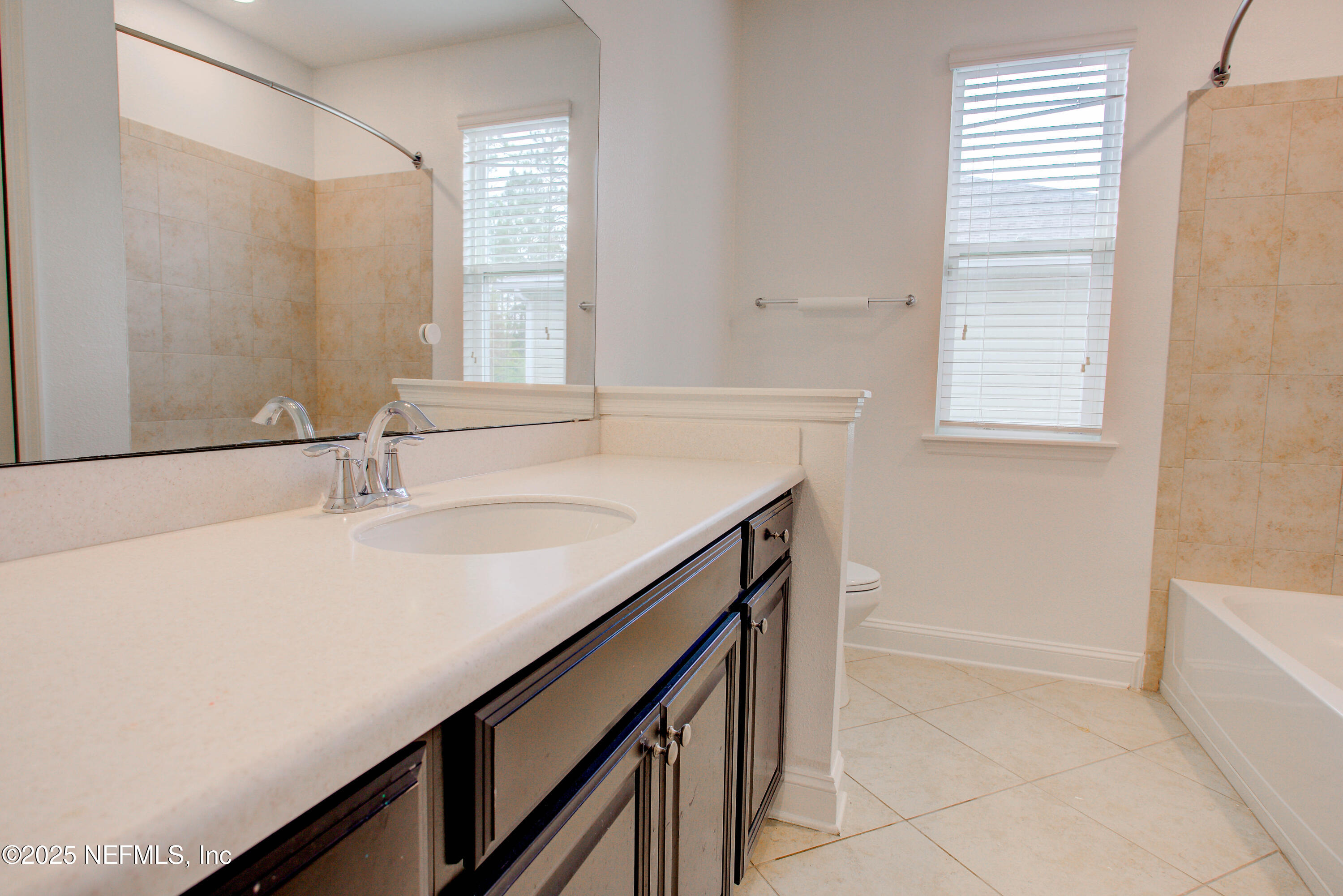 174 Antilles Road St. Augustine, FL 32092 - Photo 71 of 88 a bathroom with a sink and a bathtub