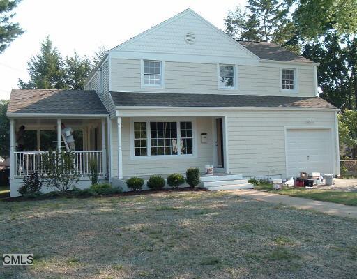 2739 Old Town Road Bridgeport, CT 06606 - Photo 1 of 1 a front view of a house with a garden