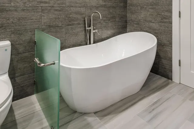 a white bath tub sitting in a bathroom
