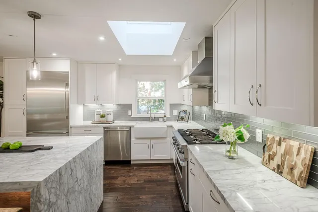 a kitchen with a sink stove and refrigerator