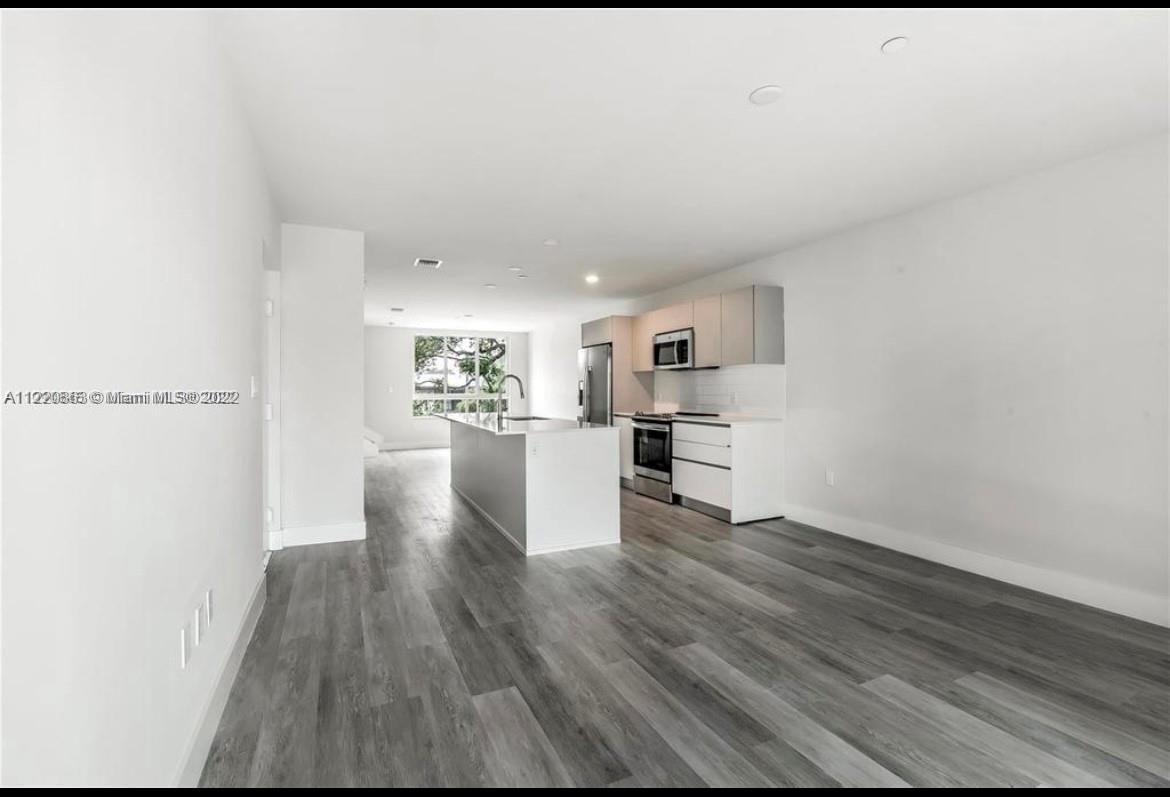 Ojus Miami, FL 33180 - Photo 9 of 10 a view of kitchen with wooden floor