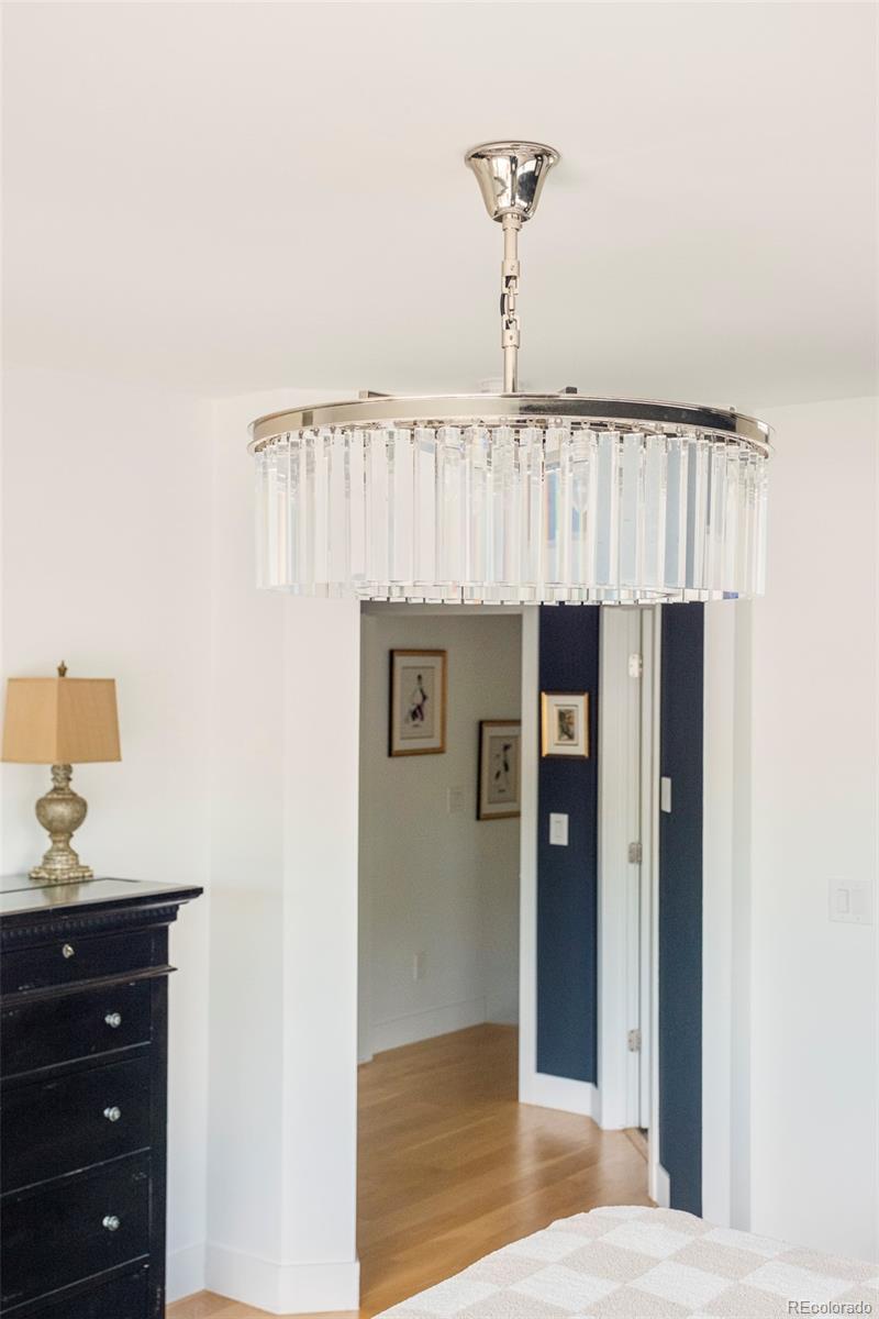 3957 Utica Street, Unit RR Denver, CO 80212 - Photo 19 of 48 a bedroom with a bed and a table