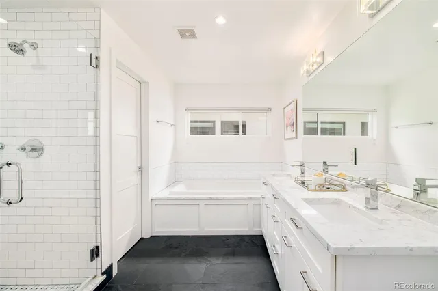 a bathroom with a sink a vanity and a mirror