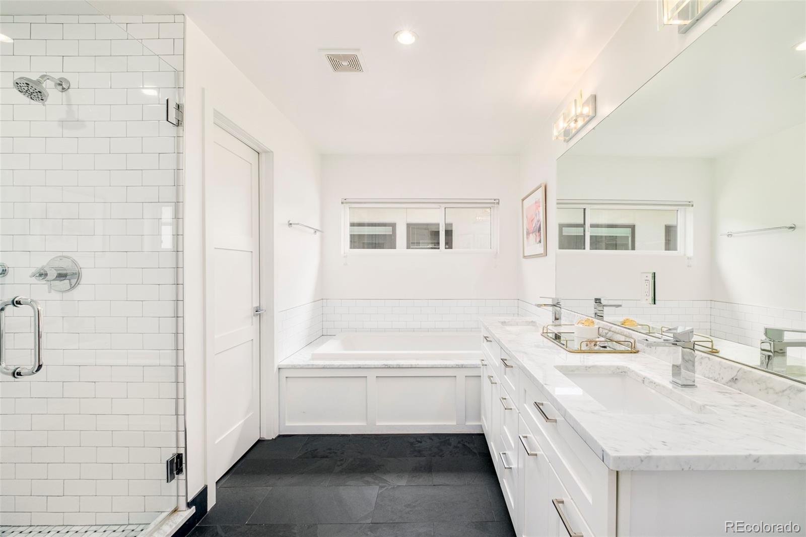 3957 Utica Street, Unit RR Denver, CO 80212 - Photo 20 of 48 a bathroom with a sink a vanity and a mirror