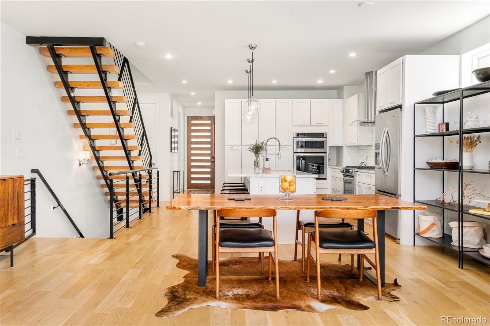 3957 Utica Street, Unit RR Denver, CO 80212 - Photo 2 of 48 a dining room with furniture and a floor to ceiling window