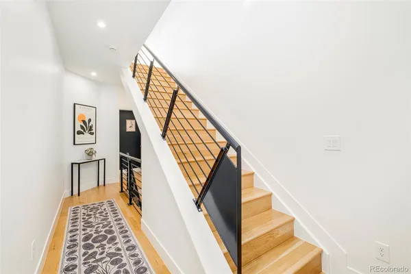 a view of entryway with wooden floor and stairs