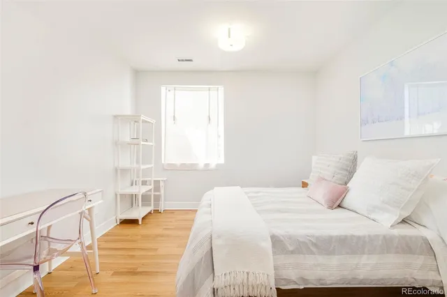 a large white bed in a white room