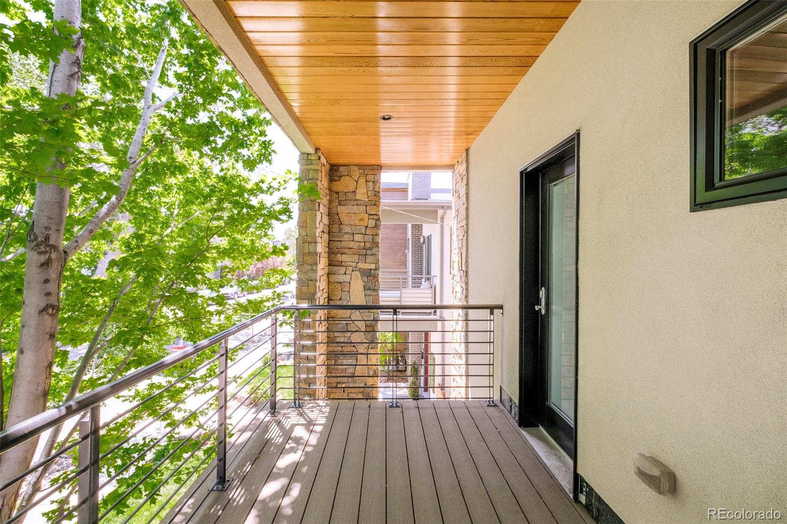 3957 Utica Street, Unit RR Denver, CO 80212 - Photo 33 of 48 a view of a room with wooden floor and windows