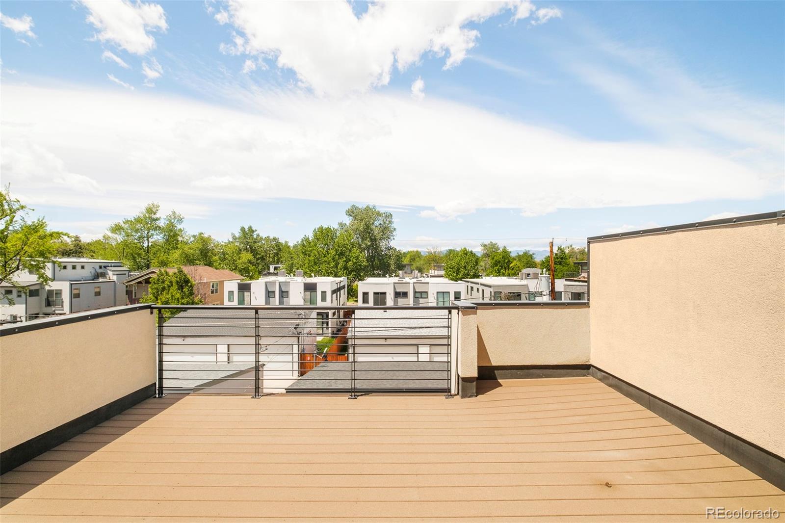3957 Utica Street, Unit RR Denver, CO 80212 - Photo 34 of 48 a view of a terrace with skyline