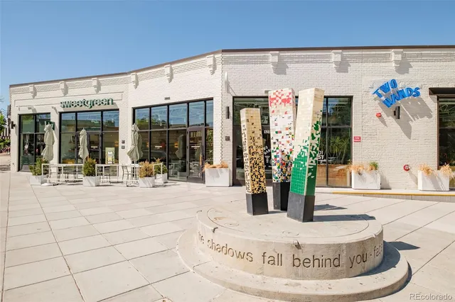 a view of a street with furniture
