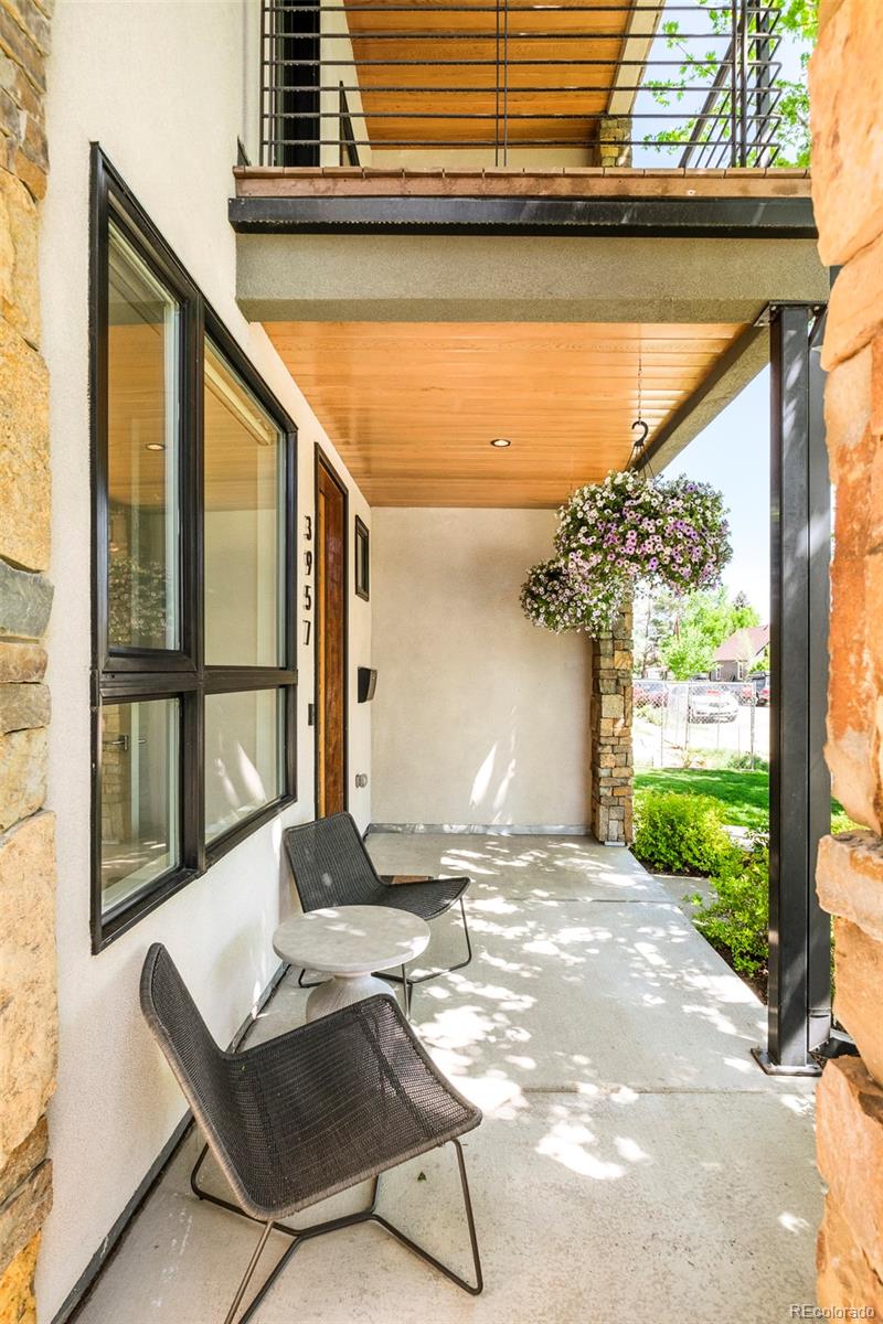 3957 Utica Street, Unit RR Denver, CO 80212 - Photo 6 of 48 a view of a two chair in the patio