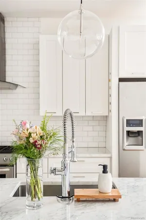 a view of living room with furniture and flowers