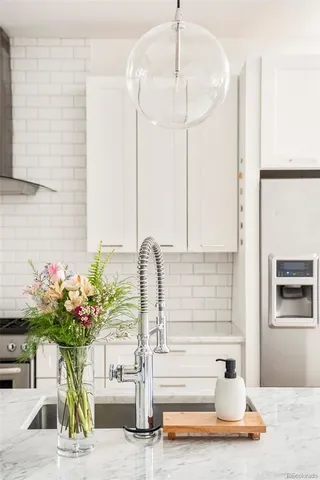 a view of living room with furniture and flowers