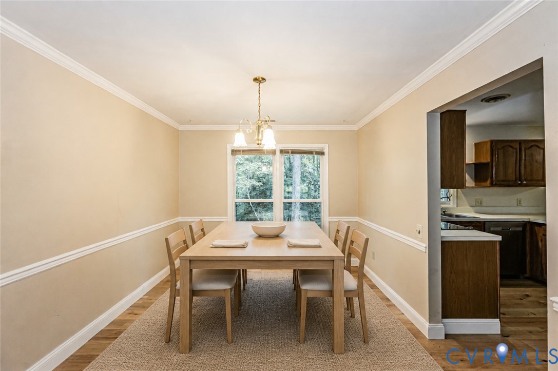 2806 Cove Ridge Road Midlothian, VA 23112 - Photo 3 of 52 Crown molding and chair rail detailing accent the