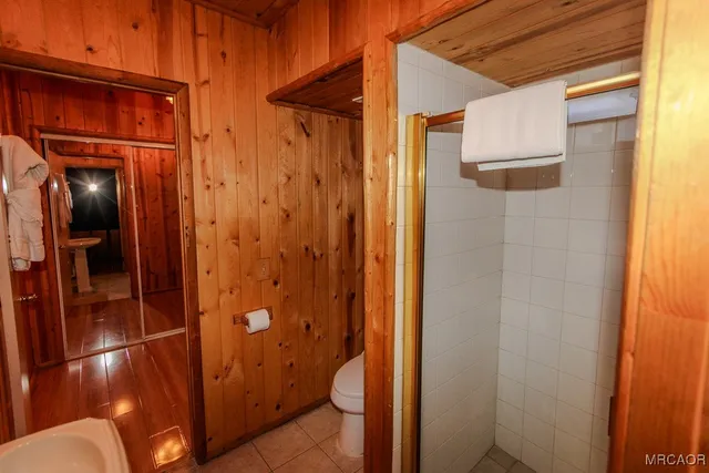 a bathroom with a glass door shower