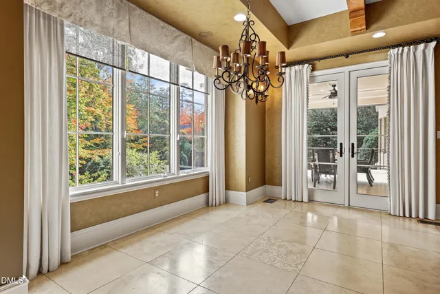 a living room with a large window and table