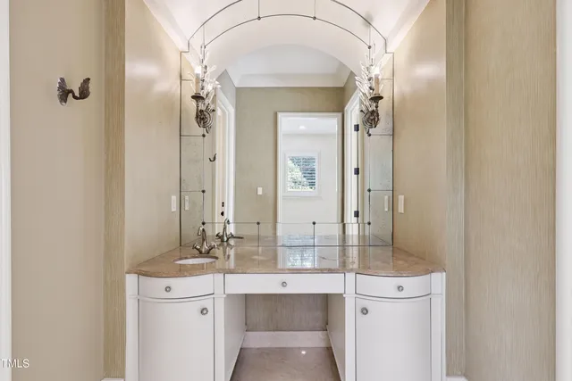 a view of a yard with plants and trees