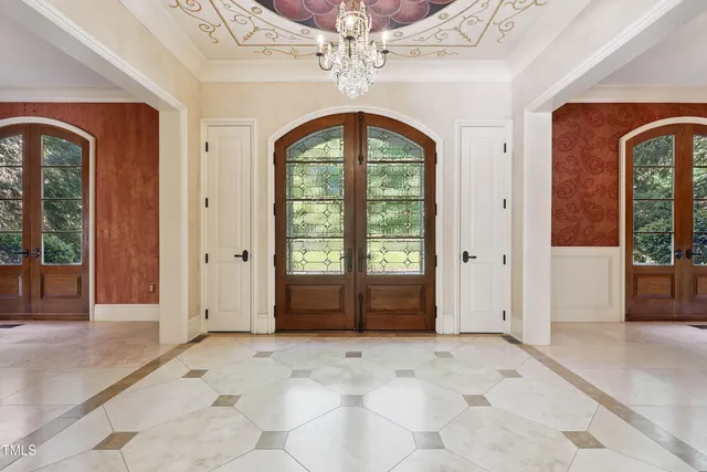 a view of a big room with chandelier windows and chandelier
