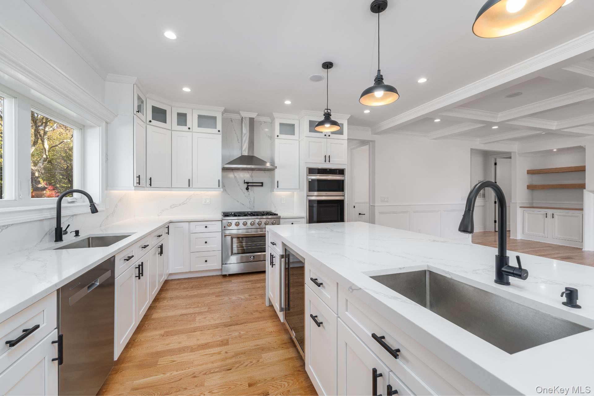 295 Grange Road Southold, NY 11971 - Photo 11 of 50 a large kitchen with stainless steel appliances kitchen island a large island in it