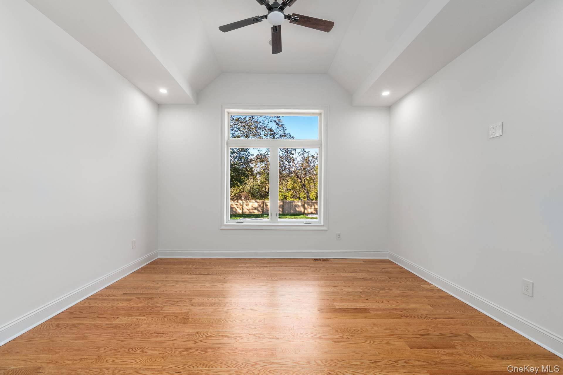 295 Grange Road Southold, NY 11971 - Photo 15 of 50 wooden floor in an empty room with a window